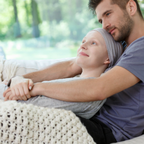Young Caucasian couple comforting each other as woman is ill
